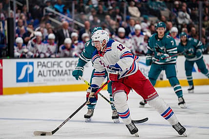 Nov 19, 2022; San Jose, California, USA; New York Rangers right wing Julien Gauthier (12) skates with the puck during the first period against the San Jose Sharks at SAP Center at San Jose. Mandatory Credit: Neville E. Guard-USA TODAY Sports