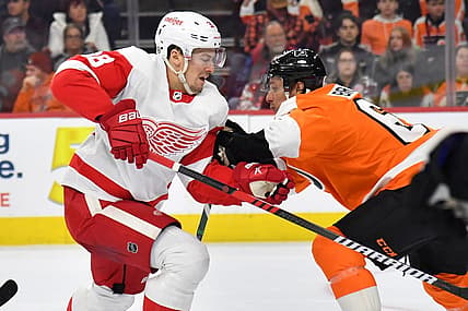Mar 5, 2023; Philadelphia, Pennsylvania, USA; Detroit Red Wings defenseman Robert Hagg (38) is checked by Philadelphia Flyers defenseman Justin Braun (61) during the first period at Wells Fargo Center. Mandatory Credit: Eric Hartline-USA TODAY Sports