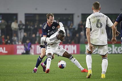 Mar 25, 2023; Washington, District of Columbia, USA; D.C. United forward Christian Benteke (20) controls the ball as New England Revolution defender Henry Kessler (4) defends in the first half at Audi Field. Mandatory Credit: Amber Searls-USA TODAY Sports