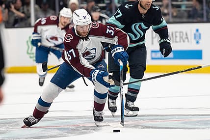 Apr 24, 2023; Seattle, Washington, USA; Colorado Avalanche forward J.T. Compher (37) skates with the puck against the Seattle Kraken in game four of the first round of the 2023 Stanley Cup Playoffs at Climate Pledge Arena. Mandatory Credit: Stephen Brashear-USA TODAY Sports
