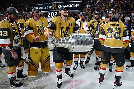 Jun 13, 2023; Las Vegas, Nevada, USA; Vegas Golden Knights forward Brett Howden (21) hoists the Stanley Cup after defeating the Florida Panthers in game five of the 2023 Stanley Cup Final at T-Mobile Arena. Mandatory Credit: Stephen R. Sylvanie-USA TODAY Sports