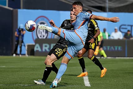 Jun 17, 2023; New York, New York, USA; New York City FC defender Braian Cufre (3) takes a shot against Columbus Crew SC midfielder Sean Zawadzki (25) during the second half at Yankee Stadium. Mandatory Credit: Brad Penner-USA TODAY Sports