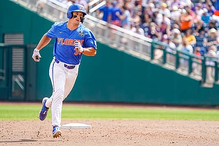 Jun 25, 2023; Omaha, NE, USA; Florida Gators center fielder Wyatt Langford (36) rounds the bases after hitting a three-run home run against the LSU Tigers during the sixth inning at Charles Schwab Field Omaha. Mandatory Credit: Dylan Widger-USA TODAY Sports
