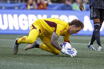 Jul 1, 2023; Seattle, Washington, USA; Houston Dynamo goalkeeper Steve Clark (12) makes a save against the Seattle Sounders FC during the first half at Lumen Field. Mandatory Credit: Joe Nicholson-USA TODAY Sports