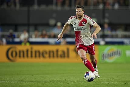 Jul 1, 2023; Cincinnati, Ohio, USA; New England Revolution midfielder Matt Polster (8) dribbles the ball against FC Cincinnati in the second half at TQL Stadium. Mandatory Credit: Aaron Doster-USA TODAY Sports