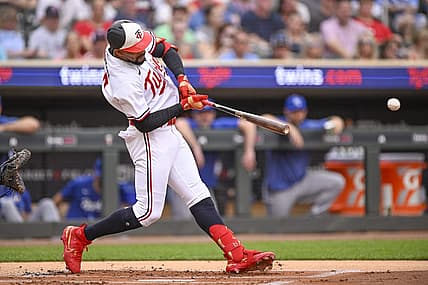 Jul 3, 2023; Minneapolis, Minnesota, USA;  Minnesota Twins designated hitter Byron Buxton (25) hits a sacrifice RBI against the Kansas City Royals during the first inning at Target Field. Mandatory Credit: Nick Wosika-USA TODAY Sports