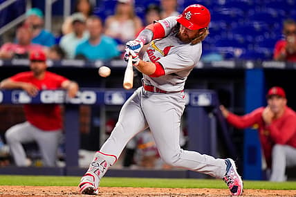 Jul 4, 2023; Miami, Florida, USA; St. Louis Cardinals second baseman Brendan Donovan (33) hits a single against the Miami Marlins during the ninth inning at loanDepot Park. Mandatory Credit: Rich Storry-USA TODAY Sports