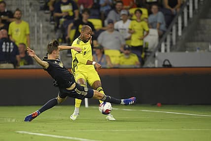 Jul 12, 2023; Nashville, Tennessee, USA;  Philadelphia Union defender Jack Elliott (3) blocks a shot from Nashville SC forward Teal Bunbury (12) in the second half at Geodis Park. Mandatory Credit: Steve Roberts-USA TODAY Sports