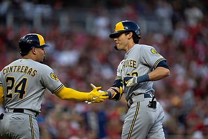 Milwaukee Brewers designated hitter Christian Yelich (22) celebrates with Milwaukee Brewers catcher William Contreras (24) after hitting a solo home run in the first inning of the MLB baseball game between the Cincinnati Reds and the Milwaukee Brewers at Great American Ball Park in Cincinnati on Saturday, July 15, 2023.