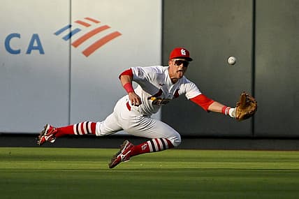 Jul 18, 2023; St. Louis, Missouri, USA;  St. Louis Cardinals center fielder Lars Nootbaar (21) dives and catches a line drive hit by Miami Marlins center fielder Dane Myers (not pictured) during the second inning at Busch Stadium. Mandatory Credit: Jeff Curry-USA TODAY Sports