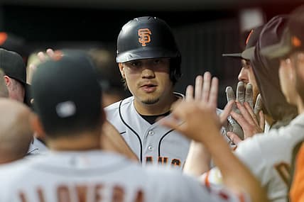 Jul 18, 2023; Cincinnati, Ohio, USA; San Francisco Giants designated hitter Wilmer Flores (41) high fives teammates after hitting a solo home run in the first inning against the Cincinnati Reds at Great American Ball Park. Mandatory Credit: Katie Stratman-USA TODAY Sports
