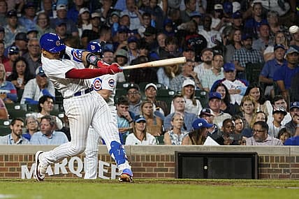 Jul 18, 2023; Chicago, Illinois, USA; Chicago Cubs catcher Miguel Amaya (6) hits a two-run single against the Washington Nationals during the seventh inning at Wrigley Field. Mandatory Credit: David Banks-USA TODAY Sports