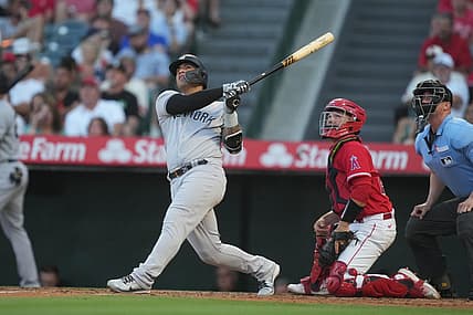 Jul 18, 2023; Anaheim, California, USA; New York Yankees second baseman Gleyber Torres (25) hits a home run in the second inning against the Los Angeles Angels at Angel Stadium. Mandatory Credit: Kirby Lee-USA TODAY Sports