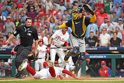 Jul 19, 2023; Philadelphia, Pennsylvania, USA; Philadelphia Phillies center fielder Brandon Marsh (16) slides safely into home as Milwaukee Brewers catcher William Contreras (24) moves out of the way during the fifth inning at Citizens Bank Park. Mandatory Credit: Eric Hartline-USA TODAY Sports