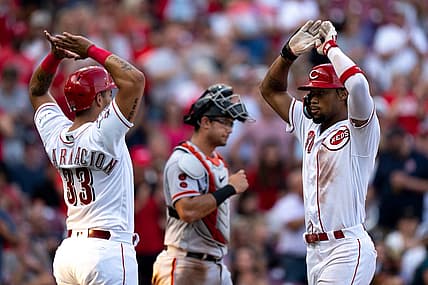 Cincinnati Reds left fielder Will Benson (30) high fives Cincinnati Reds first baseman Christian Encarnacion-Strand (33) after hitting a 3-run home run in the third inning of the baseball game between the Cincinnati Reds and San Francisco Giants at Great American Ball Park in Cincinnati on Wednesday, July 19, 2023.
