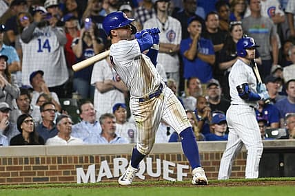Jul 19, 2023; Chicago, Illinois, USA;  Chicago Cubs second baseman Nico Hoerner (2) his a grand slam against the Washington Nationals during the eighth inning at Wrigley Field. Mandatory Credit: Matt Marton-USA TODAY Sports