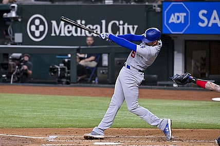 Jul 21, 2023; Arlington, Texas, USA; Los Angeles Dodgers first baseman Freddie Freeman (5) hits a double and drives in two runs against the Texas Rangers during the third inning at Globe Life Field. Mandatory Credit: Jerome Miron-USA TODAY Sports