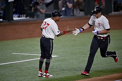 Jul 21, 2023; Arlington, Texas, USA; Texas Rangers shortstop Corey Seager (5) rounds the bases past third base coach Tony Beasley (27) after he hits a home run against the Los Angeles Dodgers during the sixth inning at Globe Life Field. Mandatory Credit: Jerome Miron-USA TODAY Sports