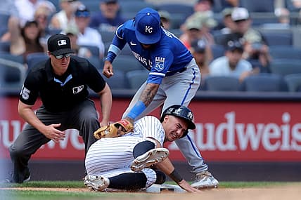 Jul 22, 2023; Bronx, New York, USA; New York Yankees shortstop Anthony Volpe (11) steals third base ahead of a tag by Kansas City Royals third baseman Maikel Garcia (11) during the third inning at Yankee Stadium. Mandatory Credit: Brad Penner-USA TODAY Sports