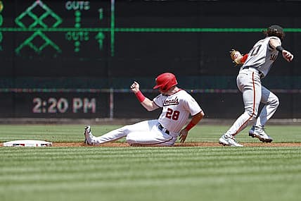 Jul 23, 2023; Washington, District of Columbia, USA; Washington Nationals right fielder Lane Thomas (28) steals second base ahead of a tag by San Francisco Giants second baseman Brett Wisely (70) during the first inning at Nationals Park. Mandatory Credit: Geoff Burke-USA TODAY Sports