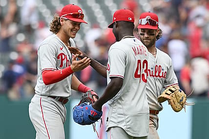 Jul 23, 2023; Cleveland, Ohio, USA; Philadelphia Phillies relief pitcher Yunior Marte (43) celebrates with third baseman Alec Bohm (28) and Bryce Harper (3) after the Phillies beat the Cleveland Guardians at Progressive Field. Mandatory Credit: Ken Blaze-USA TODAY Sports