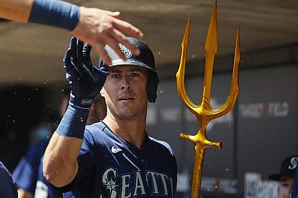 Jul 26, 2023; Minneapolis, Minnesota, USA; Seattle Mariners shortstop Dylan Moore (25) celebrates his solo home run with teammates in the dugout against the Minnesota Twins in the second inning at Target Field. Mandatory Credit: Bruce Kluckhohn-USA TODAY Sports