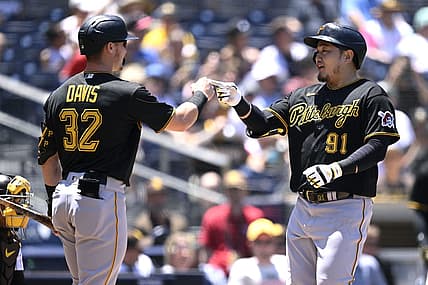 Jul 26, 2023; San Diego, California, USA; Pittsburgh Pirates first baseman Ji-Man Choi (91) is congratulated by right fielder Henry Davis (32) after hitting a home run against the San Diego Padres during the second inning at Petco Park. Mandatory Credit: Orlando Ramirez-USA TODAY Sports