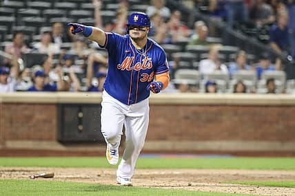 Jul 27, 2023; New York City, New York, USA; New York Mets designated hitter Daniel Vogelbach (32) points to the dugout after hitting a game-tying RBI single in the eighth inning against the Washington Nationals at Citi Field. Mandatory Credit: Wendell Cruz-USA TODAY Sports