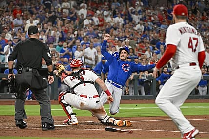 Jul 28, 2023; St. Louis, Missouri, USA;  Chicago Cubs center fielder Cody Bellinger (24) is tagged out at home plate by St. Louis Cardinals catcher Andrew Knizner (7) during the sixth inning at Busch Stadium. Mandatory Credit: Jeff Curry-USA TODAY Sports