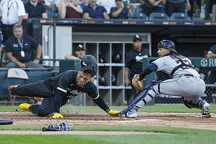 Jul 29, 2023; Chicago, Illinois, USA; Cleveland Guardians catcher Bo Naylor (23) tags out at home plate Chicago White Sox third baseman Yoan Moncada (10) during the fourth inning at Guaranteed Rate Field. Mandatory Credit: Kamil Krzaczynski-USA TODAY Sports