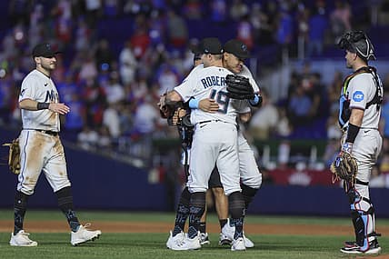 Jul 30, 2023; Miami, Florida, USA; Miami Marlins right fielder Avisail Garcia (24) celebrates with relief pitcher David Robertson (19) after defeating the Detroit Tigers at loanDepot Park. Mandatory Credit: Sam Navarro-USA TODAY Sports