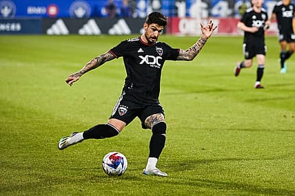 Apr 15, 2023; Montreal, Quebec, CAN;DC United forward Taxi Fountas (11) kicks the ball during the first half against D.C. United at Stade Saputo. Mandatory Credit: David Kirouac-USA TODAY Sports