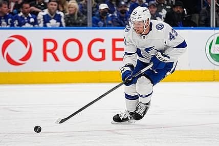 Apr 18, 2023; Toronto, Ontario, CAN; Tampa Bay Lightning defenseman Darren Raddysh (43) tries to control a puck during game one of the first round of the 2023 Stanley Cup Playoffs at Scotiabank Arena. Mandatory Credit: John E. Sokolowski-USA TODAY Sports