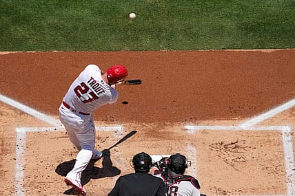 Jul 2, 2023; Anaheim, California, USA; Los Angeles Angels center fielder Mike Trout (27) hits a solo home run in the first inning against the Arizona Diamondbacks at Angel Stadium. Mandatory Credit: Kirby Lee-USA TODAY Sports