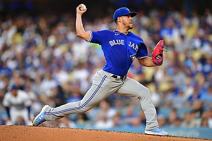 Jul 24, 2023; Los Angeles, California, USA; Toronto Blue Jays starting pitcher Jose Berrios (17) throws against the Los Angeles Dodgers during the first inning at Dodger Stadium. Mandatory Credit: Gary A. Vasquez-USA TODAY Sports