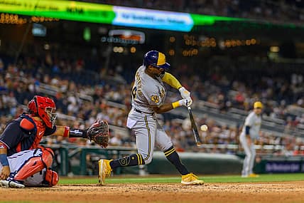 Jul 31, 2023; Washington, District of Columbia, USA; Milwaukee Brewers third baseman Andruw Monasterio (14) hits a single during the sixth inning against the Washington Nationals at Nationals Park. Mandatory Credit: Reggie Hildred-USA TODAY Sports