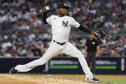 Jul 31, 2023; Bronx, New York, USA; New York Yankees starting pitcher Domingo German (0) delivers a pitch during the seventh inning against the Tampa Bay Rays at Yankee Stadium. Mandatory Credit: Vincent Carchietta-USA TODAY Sports