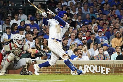 Aug 1, 2023; Chicago, Illinois, USA; Chicago Cubs right fielder Mike Tauchman (40) hits a three-run homer against the Cincinnati Reds during the third inning at Wrigley Field. Mandatory Credit: David Banks-USA TODAY Sports