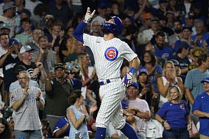Aug 1, 2023; Chicago, Illinois, USA; Chicago Cubs shortstop Dansby Swanson (7) gestures after hitting a two-run homer against the Cincinnati Reds during the fourth inning at Wrigley Field. Mandatory Credit: David Banks-USA TODAY Sports