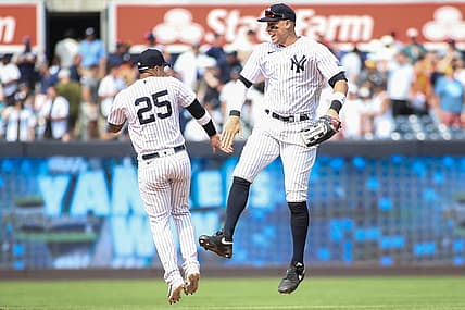Aug 5, 2023; Bronx, New York, USA;  New York Yankees second baseman Gleyber Torres (25) and right fielder Aaron Judge (99) celebrate after defeating the Houston Astros 3-1 at Yankee Stadium. Mandatory Credit: Wendell Cruz-USA TODAY Sports