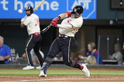 Aug 5, 2023; Arlington, Texas, USA; Texas Rangers designated hitter Robbie Grossman (4) hits an three-run home run against the Miami Marlins during the fourth inning at Globe Life Field. Mandatory Credit: Jim Cowsert-USA TODAY Sports