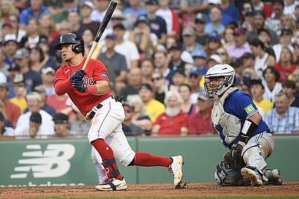Aug 5, 2023; Boston, Massachusetts, USA;  Boston Red Sox third baseman Luis Urias (17) hits an RBI single during the ninth inning against the Toronto Blue Jays at Fenway Park. Mandatory Credit: Bob DeChiara-USA TODAY Sports