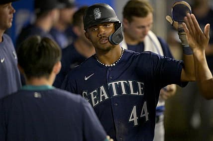Aug 5, 2023; Anaheim, California, USA;  Seattle Mariners center fielder Julio Rodriguez (44) is congratulated in the dugout after scoring a run in the eighth inning against the Los Angeles Angels at Angel Stadium. Mandatory Credit: Jayne Kamin-Oncea-USA TODAY Sports