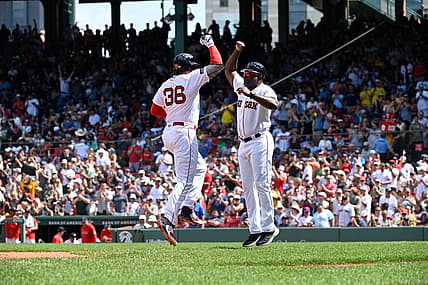 Aug 6, 2023; Boston, Massachusetts, USA; Boston Red Sox first baseman Triston Casas (36) celebrates his home run against the Toronto Blue Jays with third base coach Carlos Febles (53) during the fourth inning at Fenway Park. Mandatory Credit: Eric Canha-USA TODAY Sports