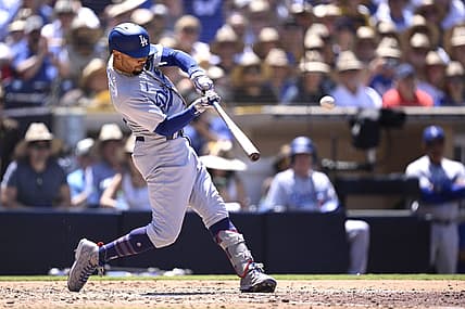 Aug 7, 2023; San Diego, California, USA; Los Angeles Dodgers second baseman Mookie Betts (50) hits a grand slam home run during the fourth inning against the San Diego Padres at Petco Park. Mandatory Credit: Orlando Ramirez-USA TODAY Sports
