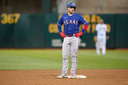 Aug 7, 2023; Oakland, California, USA; Texas Rangers catcher Mitch Garver (18) stands on second base after hitting his second double of the game against the Oakland Athletics during the sixth inning at Oakland-Alameda County Coliseum. Mandatory Credit: Robert Edwards-USA TODAY Sports