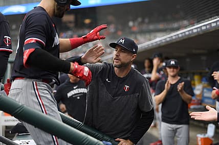 Aug 9, 2023; Detroit, Michigan, USA;  Minnesota Twins first baseman Joey Gallo (13) is congratulated on the dug out steps by manager Rocco Baldelli (5) after hitting a two run home run off Detroit Tigers starting pitcher Alex Faedo (49) (not pictured)  in the second inning at Comerica Park. Mandatory Credit: Lon Horwedel-USA TODAY Sports