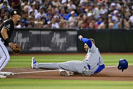 Aug 9, 2023; Phoenix, Arizona, USA;  Los Angeles Dodgers first baseman Freddie Freeman (5) slides into third base in the fourth inning at Chase Field. Mandatory Credit: Matt Kartozian-USA TODAY Sports
