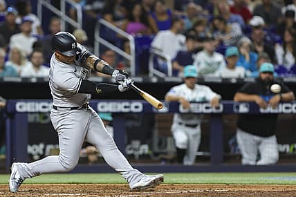 Aug 11, 2023; Miami, Florida, USA; New York Yankees second baseman Gleyber Torres (25) hits a double against the Miami Marlins during the sixth inning at loanDepot Park. Mandatory Credit: Sam Navarro-USA TODAY Sports