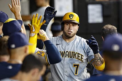 Aug 11, 2023; Chicago, Illinois, USA; Milwaukee Brewers catcher Victor Caratini (7) celebrates with teammates after scoring against the Chicago White Sox during the second inning at Guaranteed Rate Field. Mandatory Credit: Kamil Krzaczynski-USA TODAY Sports